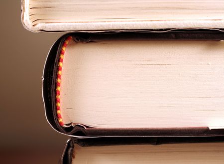 A sideview of a book displaying the binding of the book.