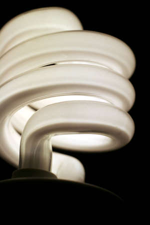 A closeup of an energy saver compact flourescent light bulb.の写真素材