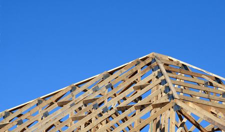The wood beams of a new homes roof.の写真素材