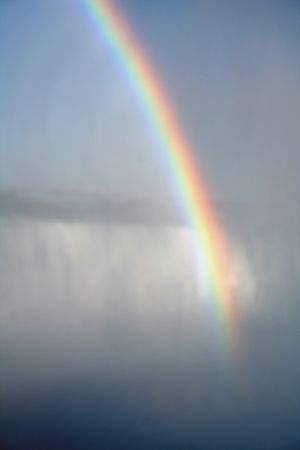 A rainbow shot against the fog of Niagara Falls.の写真素材