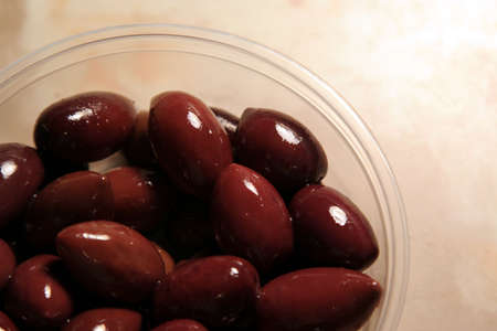 A container of juicy kalamata olives.の写真素材