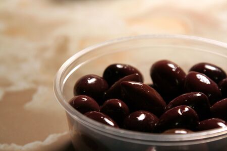 A container of juicy kalamata olives.の写真素材