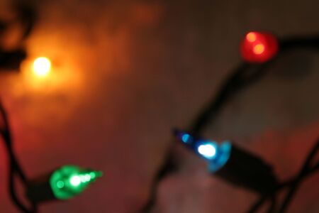 Four out of focus lit Christmas lights.の写真素材