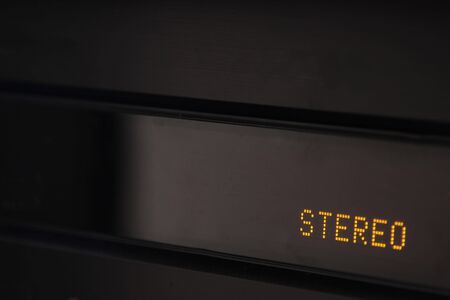 A closeup of a digital display on an amplifier that says stereo.の写真素材