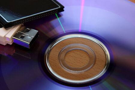 Three different pieces of media storage. (USB stick, compact flash and a DVD)の写真素材