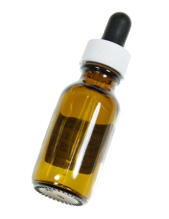 A dropper bottle containing naturopathic medicine, isolated on a white background.
の写真素材