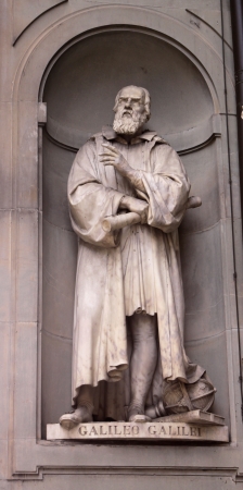 A statue Galileo Galilei sitting outside of the Uffizi, in Florence, Italy.  Galileo is a famous astronomer.の写真素材