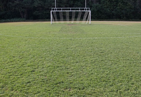 A view of the goal on a vacant soccer pitch.の写真素材
