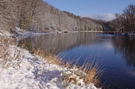 The Grand River with snow covering the banks.  Shot in Kitchener, Ontario, Canada.の写真素材