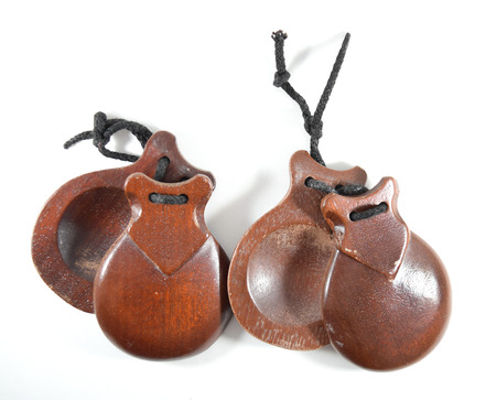 Spanish castañuelas (castanets) - percussion instrument used in flamenco, sevillanas dance in Spain - isolatedの写真素材