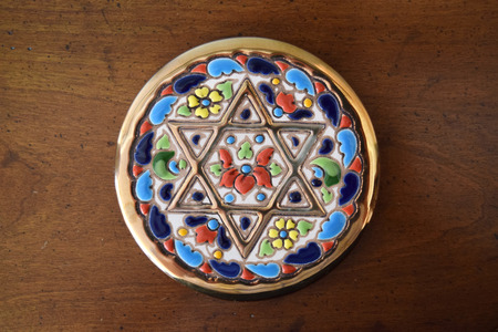 Decorative coaster with golden Jewish Star of David inlayの写真素材