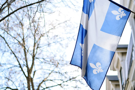 Quebec flag in Montreal billowing in the breeze outsideの写真素材