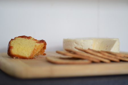 Traditional Brazilian cheese board (cheese from Minas Gerais) breakfast with wheat crackers, and bolo de fuba (Portuguese translation: cornmeal cake) with guava spreadの写真素材