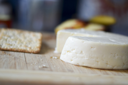 Traditional Brazilian cheese board (cheese from Minas Gerais) breakfast with wheat crackers, and...