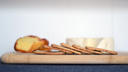 Traditional Brazilian cheese board (cheese from Minas Gerais) breakfast with wheat crackers, and bolo de fuba (Portuguese translation: cornmeal cake) with guava spreadの写真素材