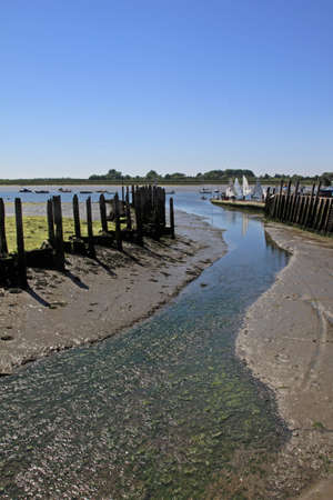 Low tide at the sailing club in Bosham, Englandの写真素材