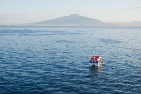 A cruise ship's tender waiting to ferry passengers ashore in the Bay of Naplesの写真素材