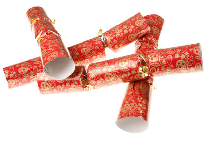 Four red christmas crackers isolated against a white backgroundの写真素材