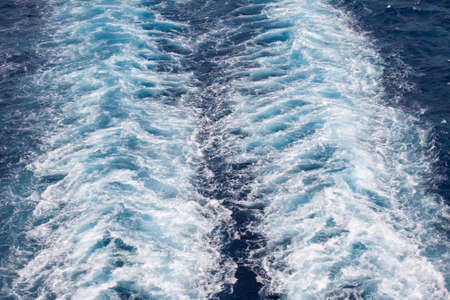 The surface of the ocean churned by the passage of a ship