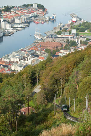 Elevated view of Bergen showing the port and the funicular railway climbing Mount Floyenの写真素材