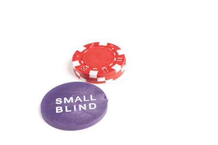 Single small stack of gaming chips behind the small blind token