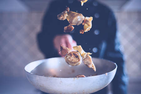 chef jumps in panの写真素材