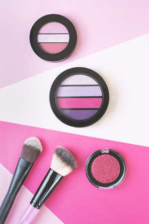 striped eyeshadow on a colored stripe backgroundの写真素材
