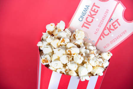 pop corn cinema and tickets on a red backgroundの写真素材