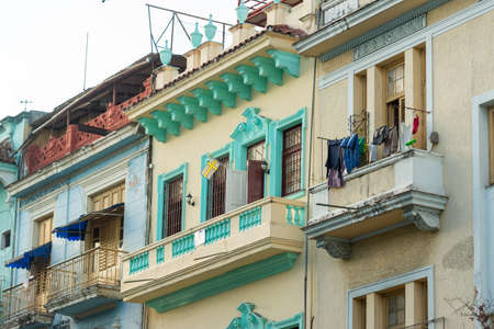 Deco and colonial architecture live side by side on the old facades of the Cuban capital.のeditorial素材