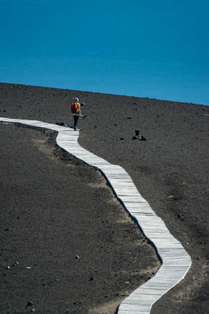 Tourists go hiking in the Osorno volcano