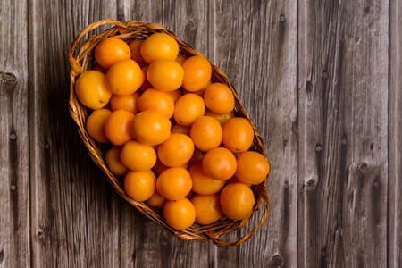 Brazilian fruit caja in the straw basket.の写真素材