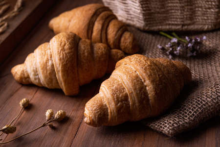 croissant buns on the wooden table.の写真素材