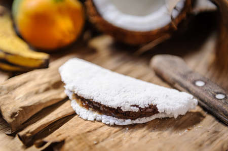 Tapioca with coconut sweet, papaya and banana. Delicacy from the northeast region of Brazil.の写真素材