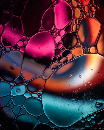 Colorful abstract background of oil bubbles in water. Macro photography.