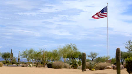 USA Flag Flying High in the Desertの写真素材
