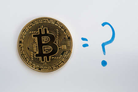 Bitcoin BTC cryptocurrency coin on a white background with a hand drawn blue question mark.の写真素材
