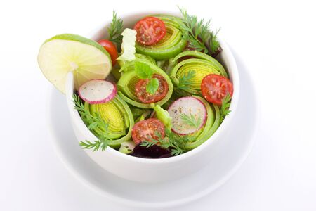 fresh spring salad in bowl with vinegar dessingの写真素材