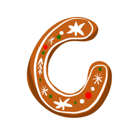 Festive gingerbread letter C with icing on a white background, adding a cozy holiday charm for winter and Christmas projectsの写真素材