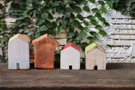 four house of toy model with nature and white backgroundの写真素材