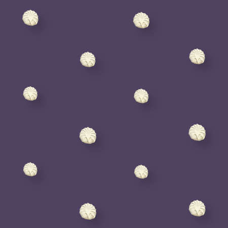 Colorful pattern of white zephyr on violet background. Marshmallow. Top view. Flat lay. Pop artの写真素材