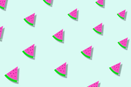 Colorful pattern of watermelon slices on light green background with shadows. Seamless pattern with watermelon slices. Top viewの写真素材