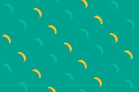 Colorful fruit pattern of yellow bananas on green background. Top view. Flat lay. Pop art designの写真素材
