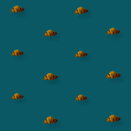 Colorful pattern of croissants on green background. Top view. Flat lay. Pop art designの写真素材