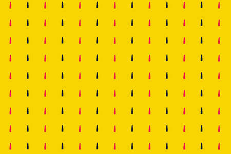 Colorful pattern of pink and black lipsticks on yellow background. Top view. Flat lay. Pop art designの写真素材