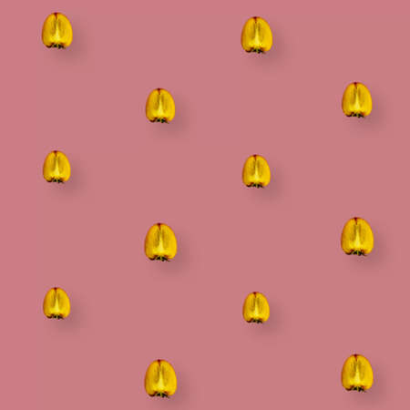 Colorful fruit pattern of fresh persimmons on pink background. Top view. Flat lay. Pop art designの写真素材