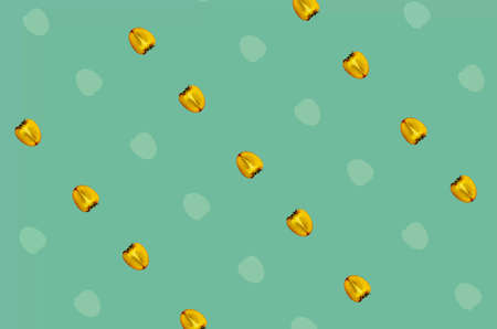 Colorful fruit pattern of fresh persimmons on green background. Top view. Flat lay. Pop art designの写真素材