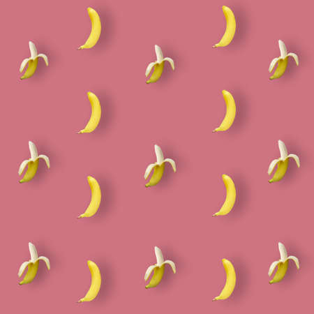 Colorful fruit pattern of yellow bananas on pink background. Top view. Flat lay. Pop art design