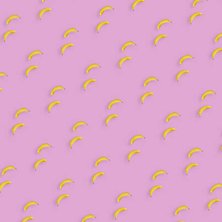 Colorful fruit pattern of yellow bananas on pink background. Top view. Flat lay. Pop art design
