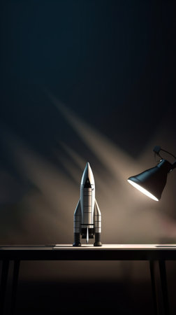 A desk with a rocket and a lamp on itの素材