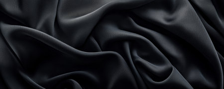 Smooth black silk fabric background texture, abstract flowing pattern. Luxury textile conceptの素材